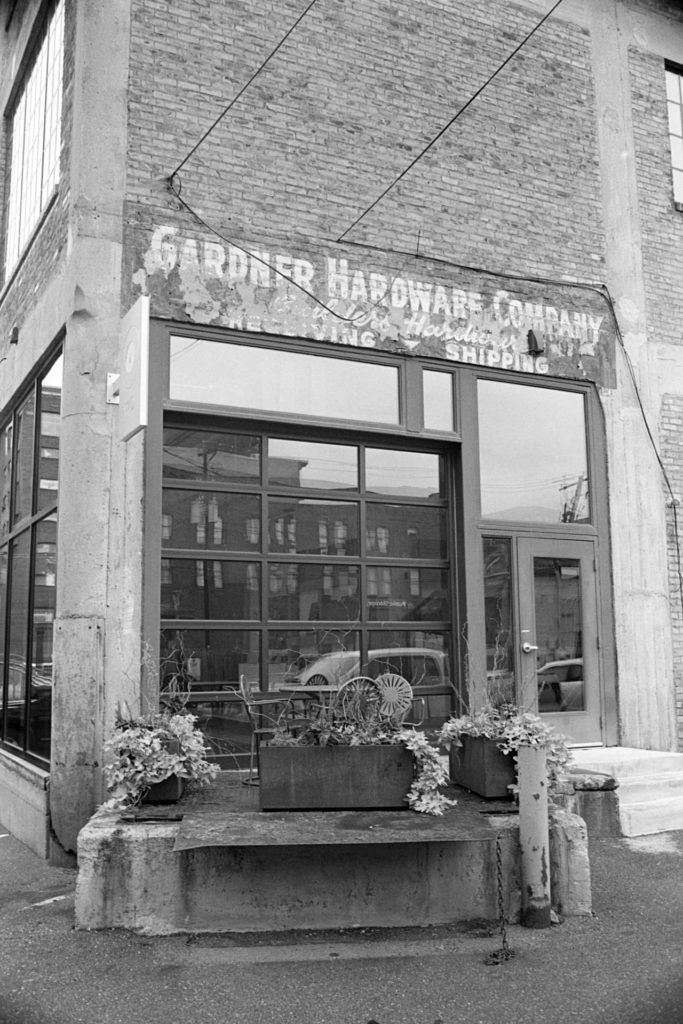 A black and white photo of a new office space built in to an old brick building in the North Loop area of Minneapolis
