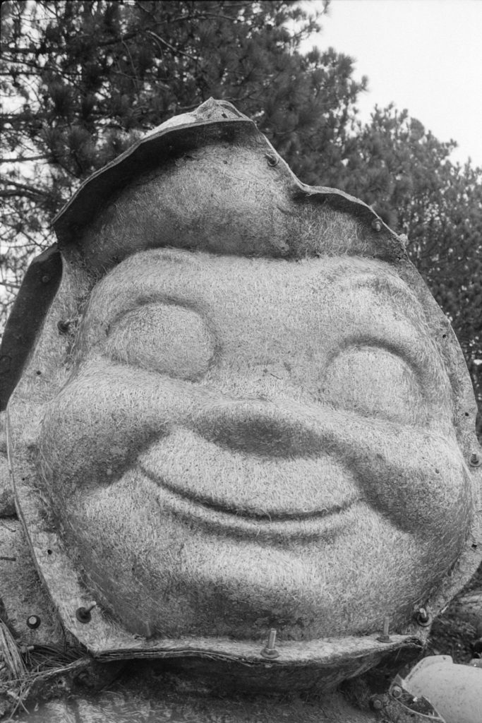 A black and white photo of a Bob's Big Boy face mold.